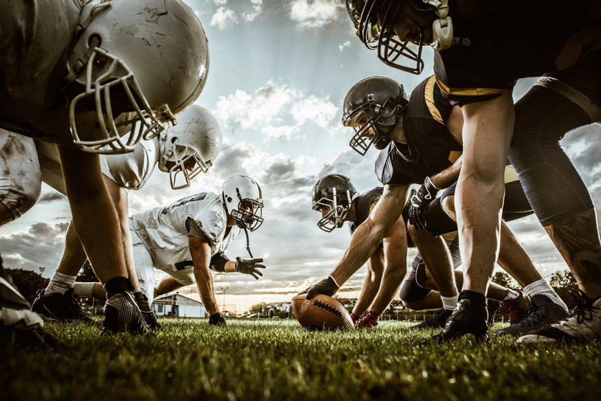 Football Players Lining Up on the Field