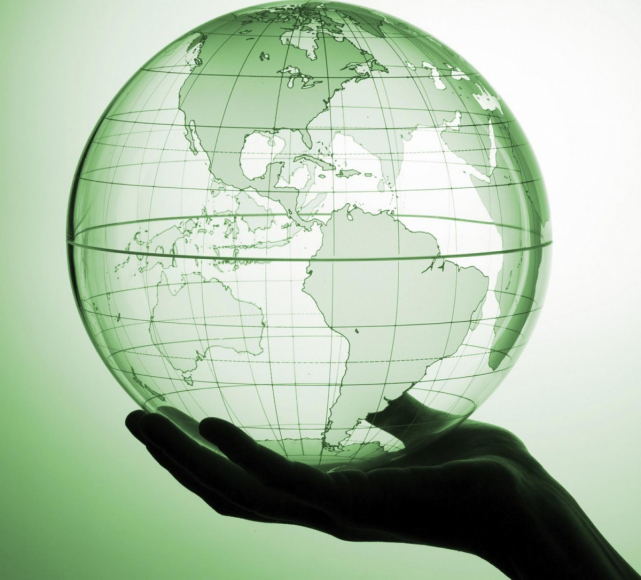 Person holding green globe