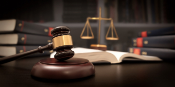 Gavel and Scales of Justice on Desk