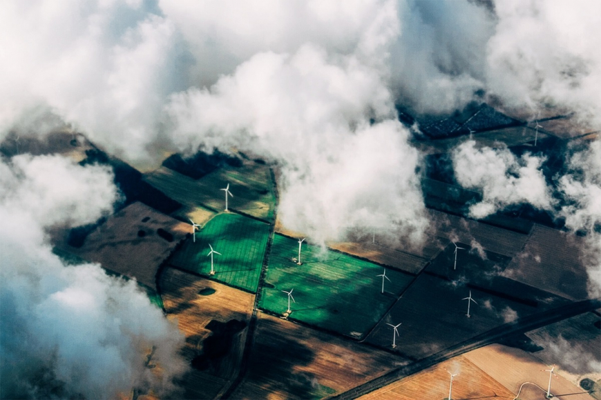 Arial view of windmills in fields