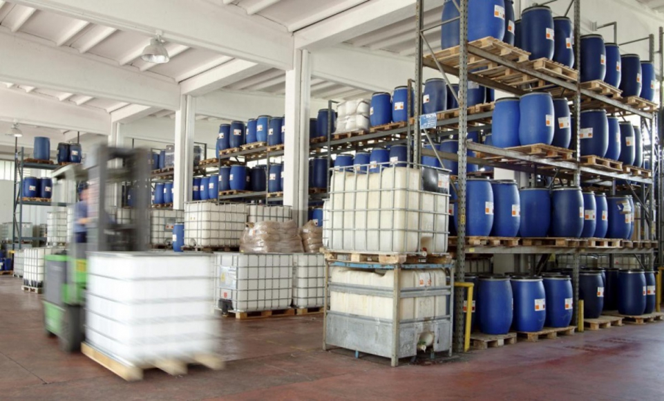 Blue containers on warehouse shelves