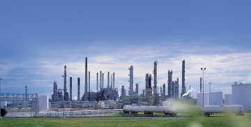 chemical plant with smoking stacks