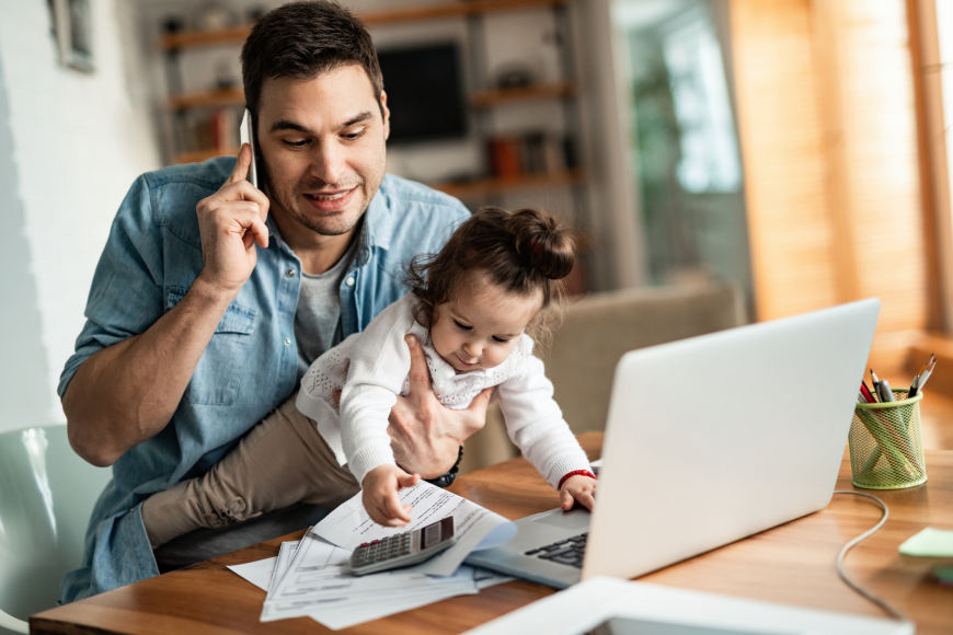 Dad working from home with baby