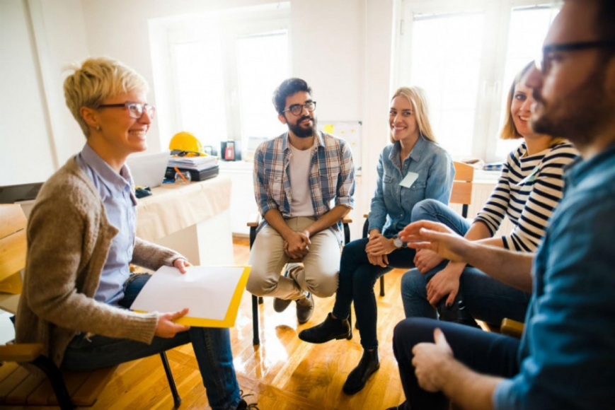 Coworkers seated in a circle