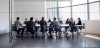 Group of business people sitting around a table