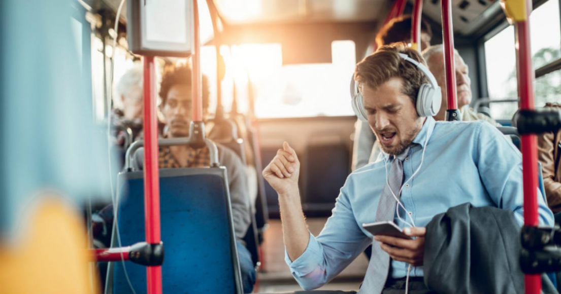 Man Listening to Music Through Headphones