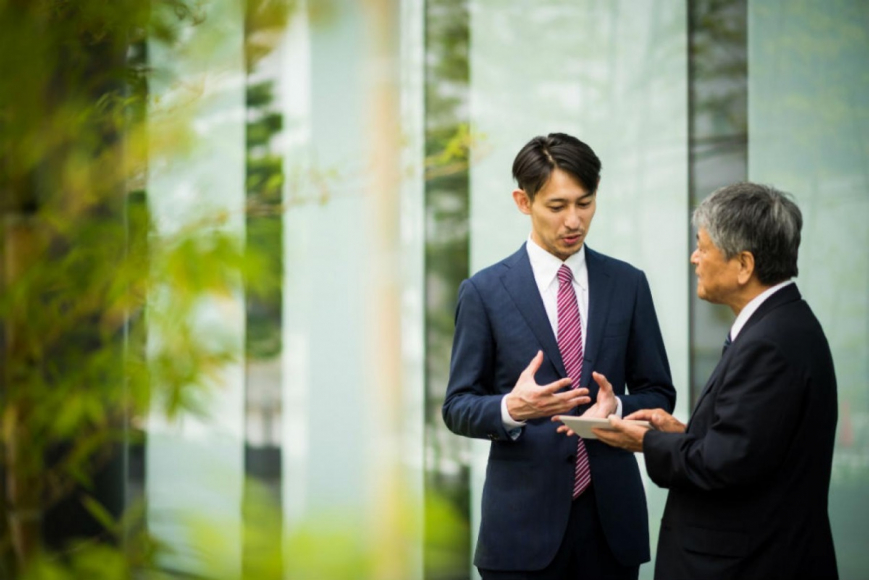 Two Business Men Talking Outside