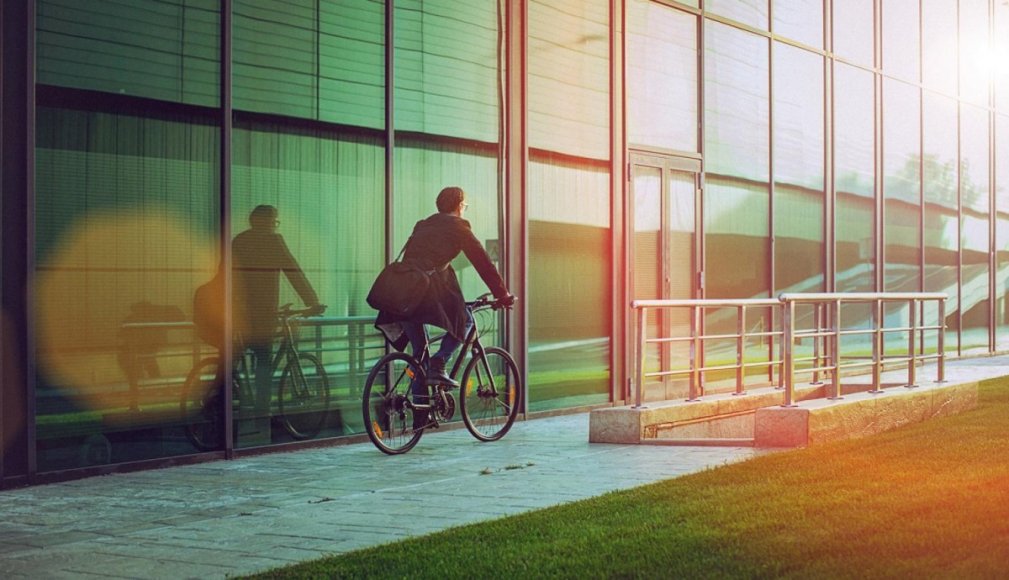 business man biking in city