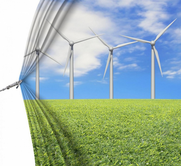 Windmills in field