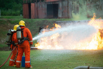 Firefighters Spraying Foam on a Fire