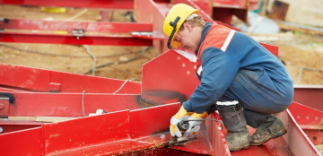 man welding metal